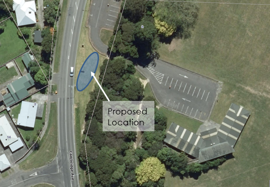 Aerial view of a road with a parking lot and a parking lot

Description automatically generated