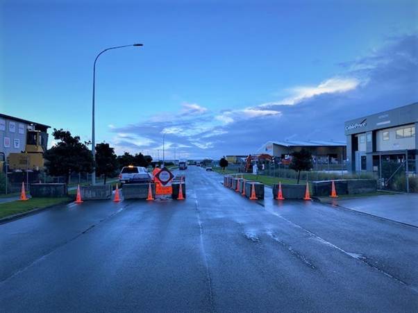 A picture containing text, road, sky, outdoor
Description automatically generated