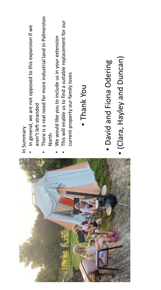 A couple of people outside in a tent

Description automatically generated